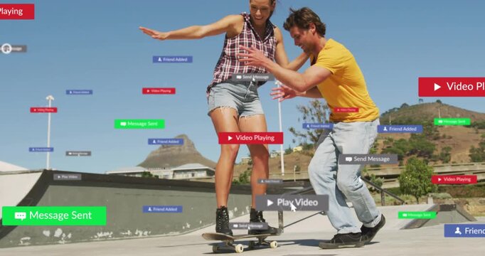 Woman learning on board while helper loosening grip to ride amid floating social media badges
