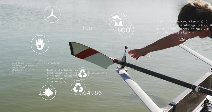 Senior rower leaning and adjusting oar collar, preparing for stroke as HUD icons showing CO2 charts
