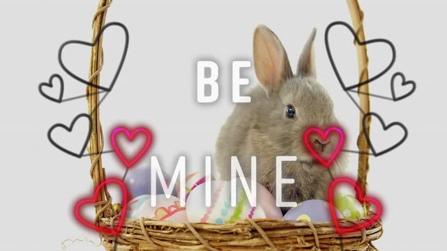 Text brightening starting neon hearts pulsing gray rabbit sitting basket tilting accenting BE MINE