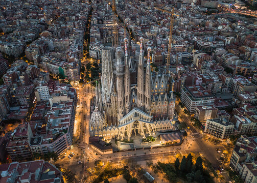 Aerial view of Sagrada Familia illuminated at twilight, Barcelona, Spain