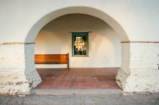 Empty Bench Under an Arch at a California Mission 