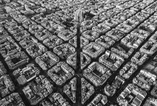 Black and white aerial view of Barcelona skyline with Eixample grid and Sagrada Familia