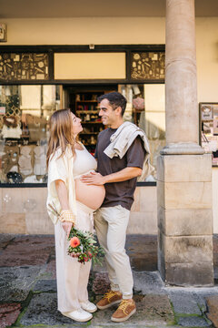 Expecting couple embracing pregnancy and preparing for new life