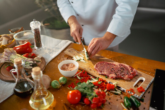 Cooking steak with fresh food
