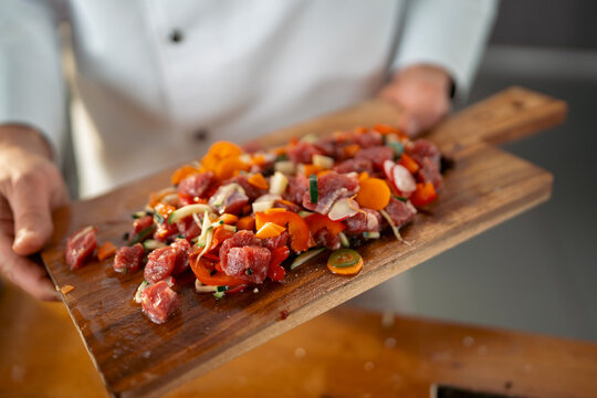 Chef preps meat & veggies
