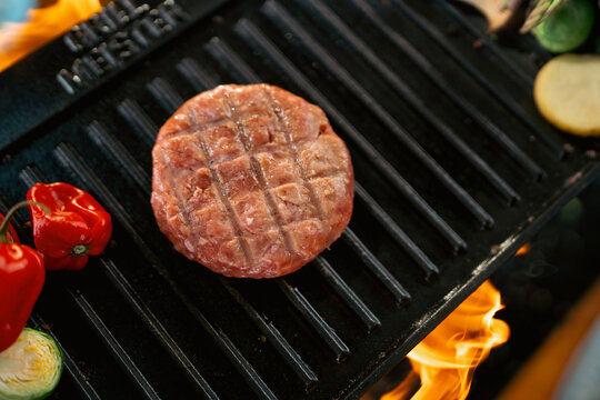 Grilling meat on a grill
