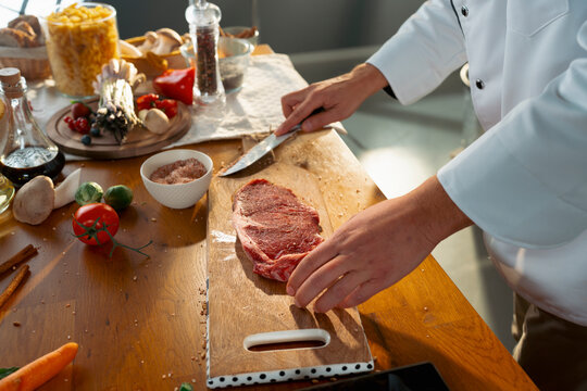 Cooking meat on a wooden board
