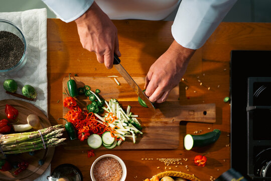 Chopping veggies in kitchen
