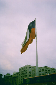 Chilean Flag Flying Above City Buildings