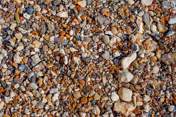 Detailed View Of Rounded River Stones And Fine Sand Creating Calming Natural Scenery Suitable For Artistic Projects