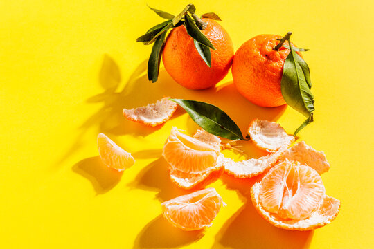 Mandarins still life with a yellow background.