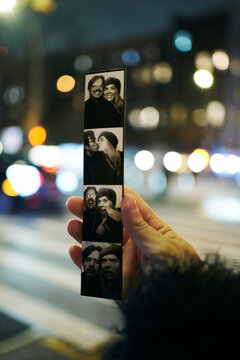 Photobooth Strip Held at Night