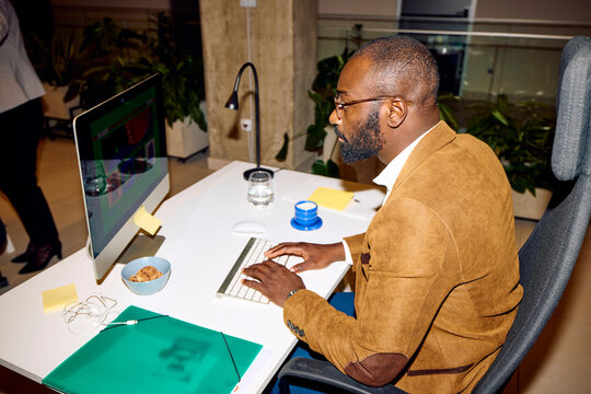 Man engaged in tasks at his computer