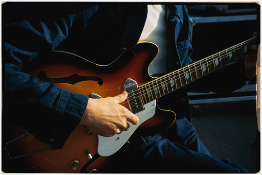 Anonymous guitarist playing a vintage electric guitar