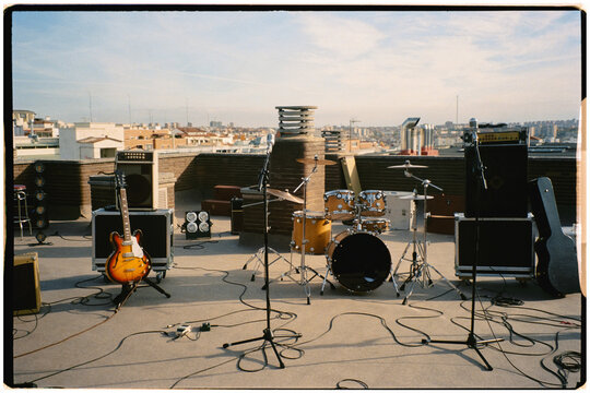 Instruments placed outdoors across a terrace while the sun descends