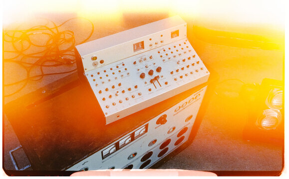 Classic sound mixing console bathed in warm sunset light