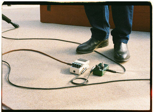 Anonymous guitarist uses guitar effects pedals 