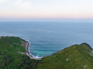 Fototapeta premium Aerial footage of the summer coastline at Dahua Jiao, Wanning, Hainan
