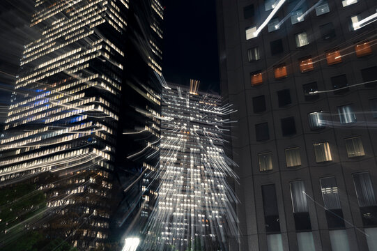 Nighttime Skyscraper with Radiating Light Trails