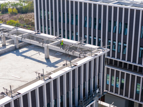 Aerial View of Construction Worker on Rooftop
