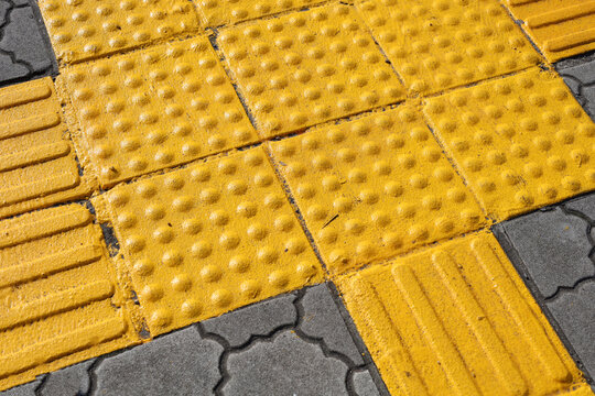 Yellow tactile paving for visually impaired