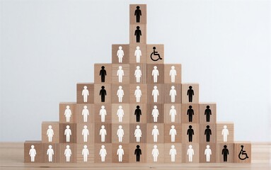 Naklejka premium Stacked wooden blocks show diverse human figures, including disabled symbols, representing inclusivity.