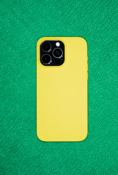 Phone Case Rests on a Green Surface in Natural Light