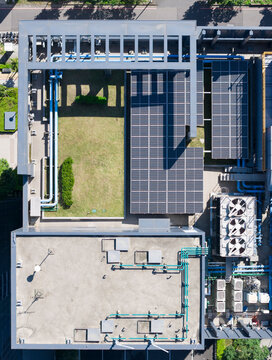 Aerial View of Rooftop Solar Panels and Building Infrastructure