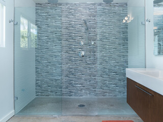 Modern walk-in shower, glass, tile, bathroom interior