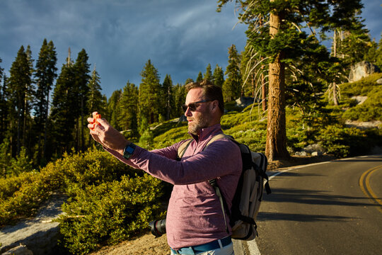 Man snaps photos in Yosemite National Park