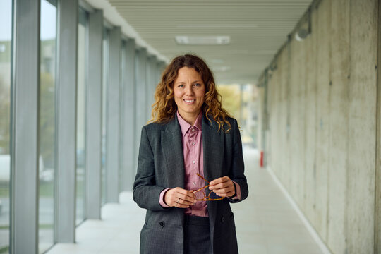 Elegant woman of business smiles for the camera