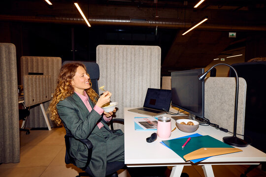 Woman enjoying lunch at work