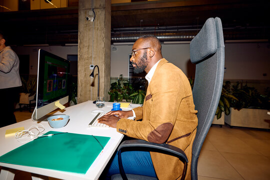 Man concentrated on his work at his computer