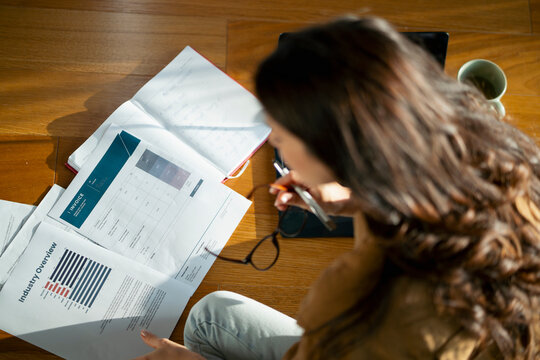 Reviewing reports and plans at home
