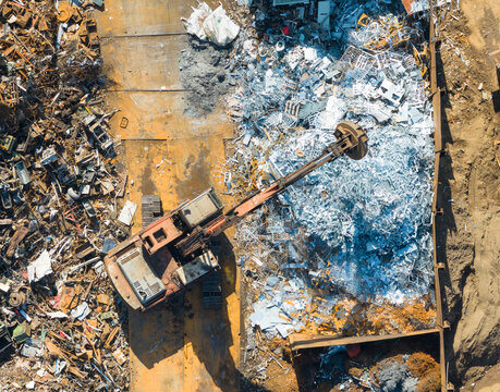 Recycling Plant Excavator Handling Crushed Metal Scraps