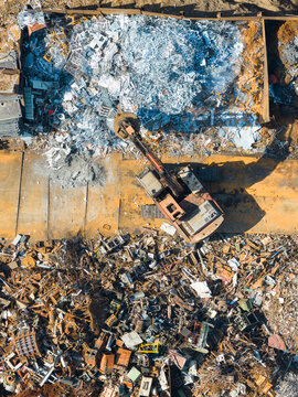 Aerial View of Excavator in Metal Recycling Yard