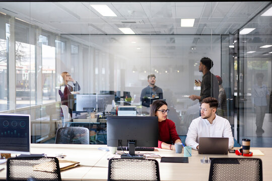 Diverse startup business colleagues working in modern office