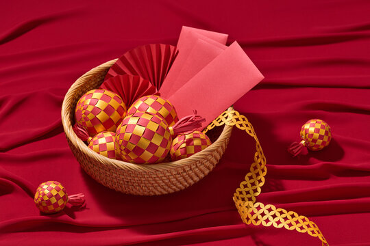 Festive Chinese New Year decorations displayed in a woven basket