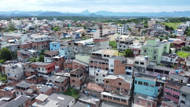 Far-reaching aerial view of a sprawling hillside urban area.