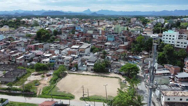 Urban settlement aerial with a church steeple in the foreground.