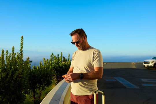 Man stands on the viewpoint near Griffith Observatory