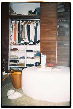 Woman&rsquo;s open wardrobe
