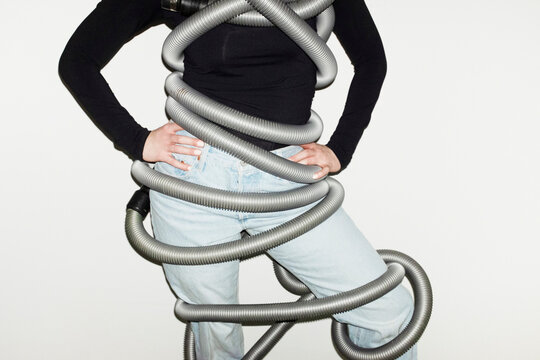 Person holding cleaning hoover vacuum cleaner with direct flashlight