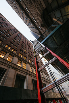 Ladder and scaffolding in dense city alley