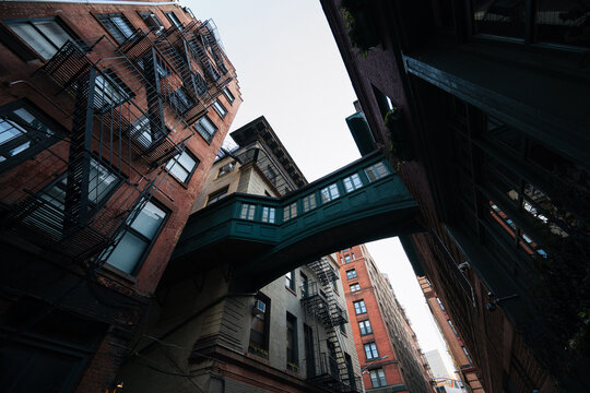 Upward view of skybridge and fire escapes in Tribeca