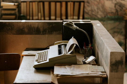 Vintage workspace with typewriter and desk lamp