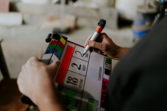 Film clapperboard being noted during scene setup