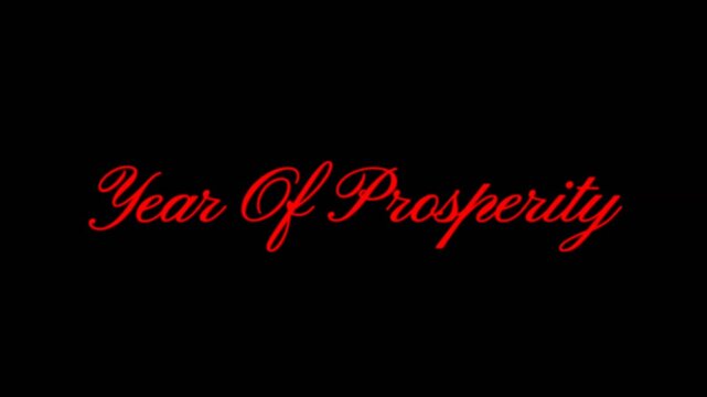 Elegant red script text animation reading Year of Prosperity on a dark background, ideal for celebration messages, new year wishes, and inspirational visual projects.