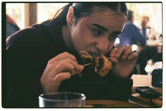  girl eating at restaurant 
