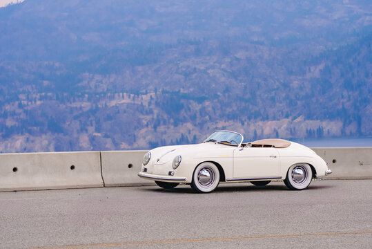 1957 Porsche 356 Speedster replica with mountains in the background